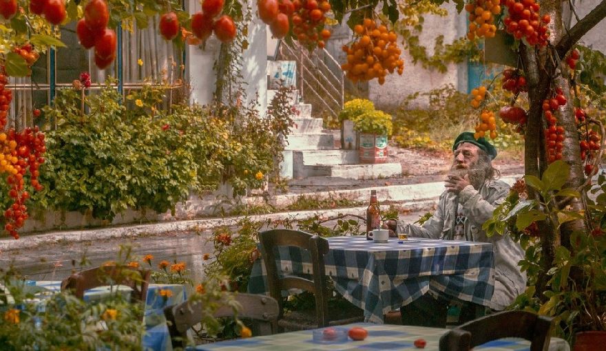 An old man is sitting at the table waiting for his food. A classic painting. The delicious food like that You can find the best Döner in Ennigerloh at Doener-curator.com